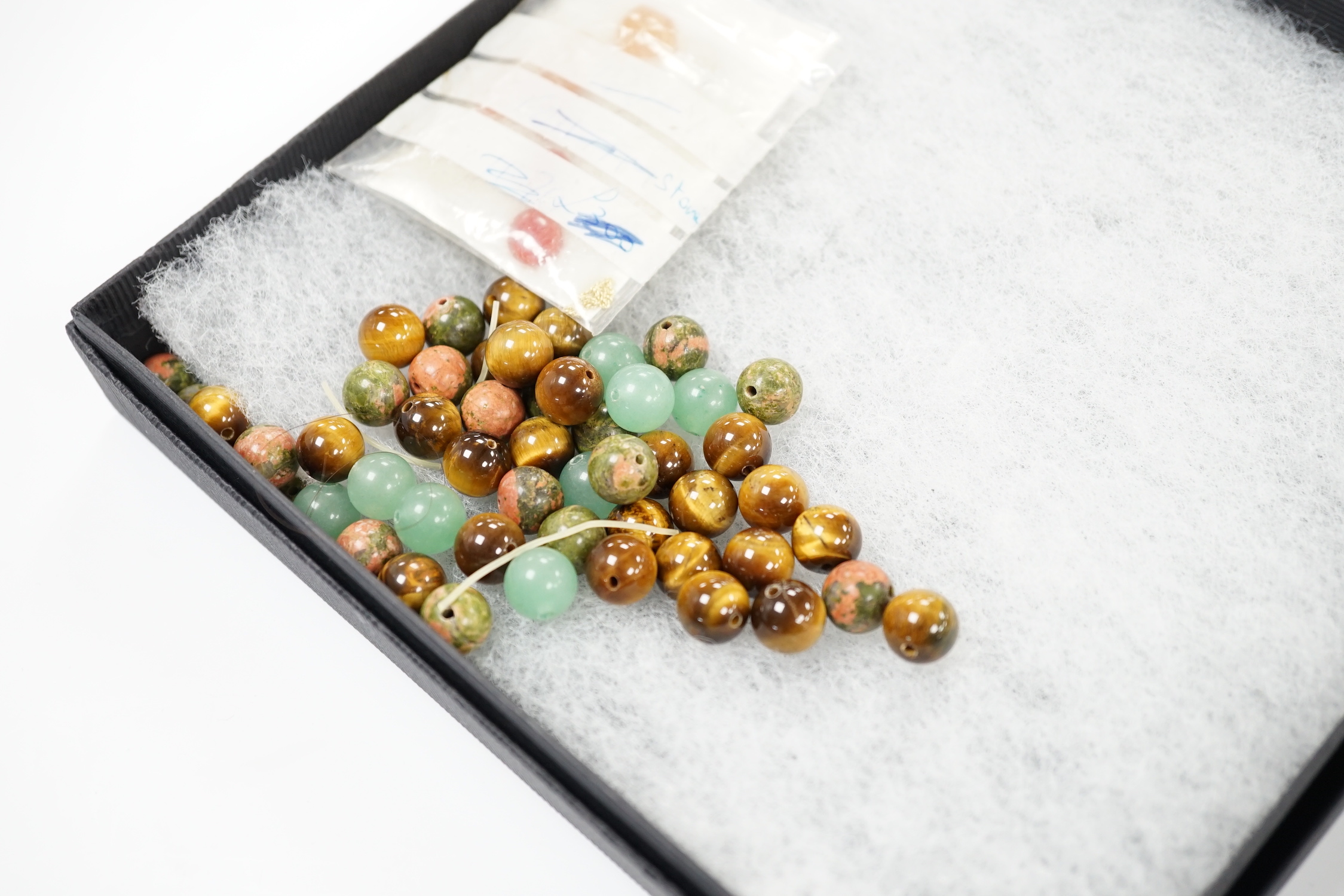 A tiger's eye quartz bead necklace, 44cm and two tiger's eye quartz bracelets, together with other bracelets including agate and loose beads.